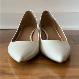 Calvin Klein white patent low block heel pumps
